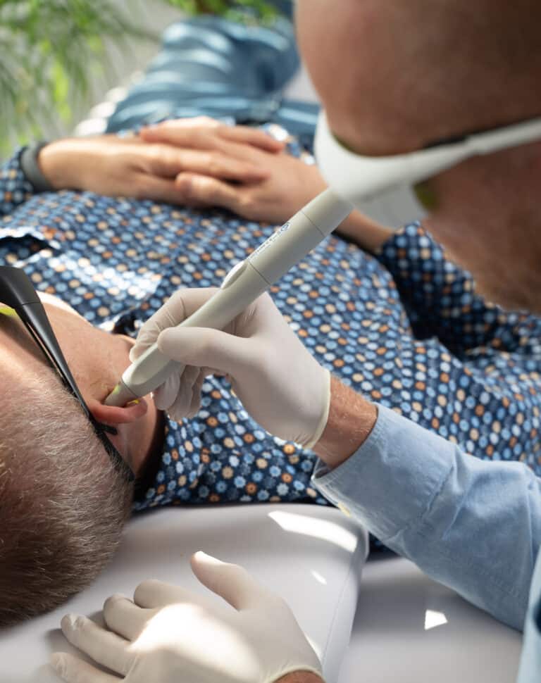 Gentle laser auricular reflexology session at a Reset Laser centre